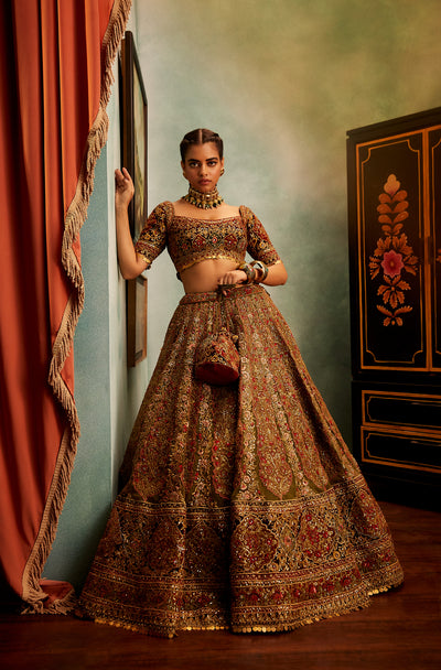 Ornate green and maroon lehenga set